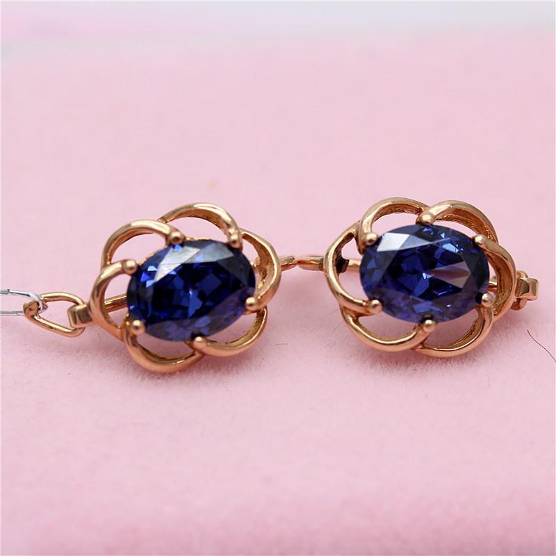 Ohrringe mit eingelegtem blauem Stein und Spitze in Lila und Gold