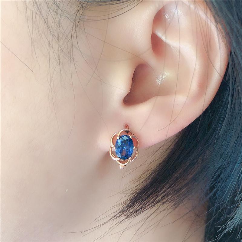 Ohrringe mit eingelegtem blauem Stein und Spitze in Lila und Gold